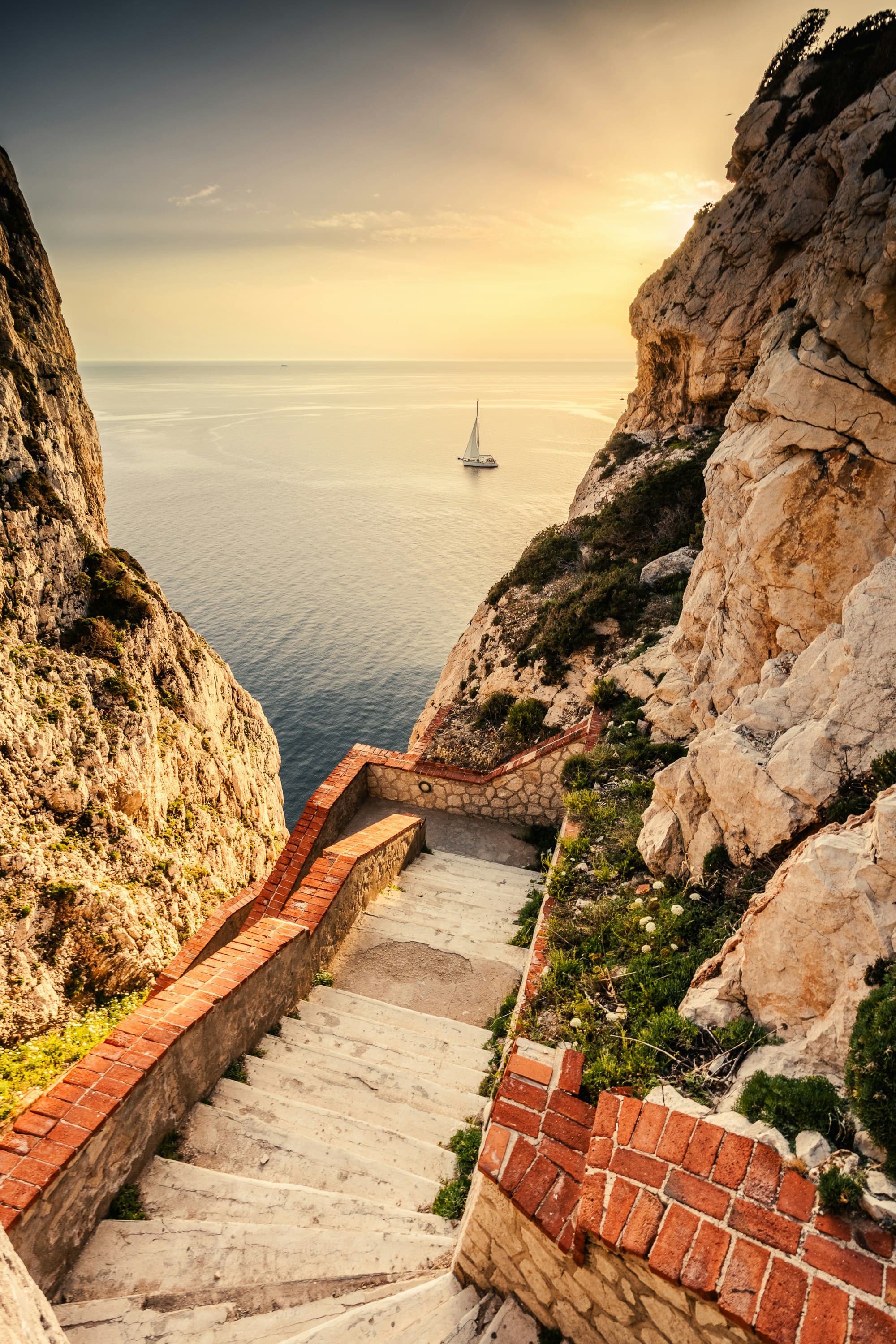 A stepped descent toward the sea at late light.