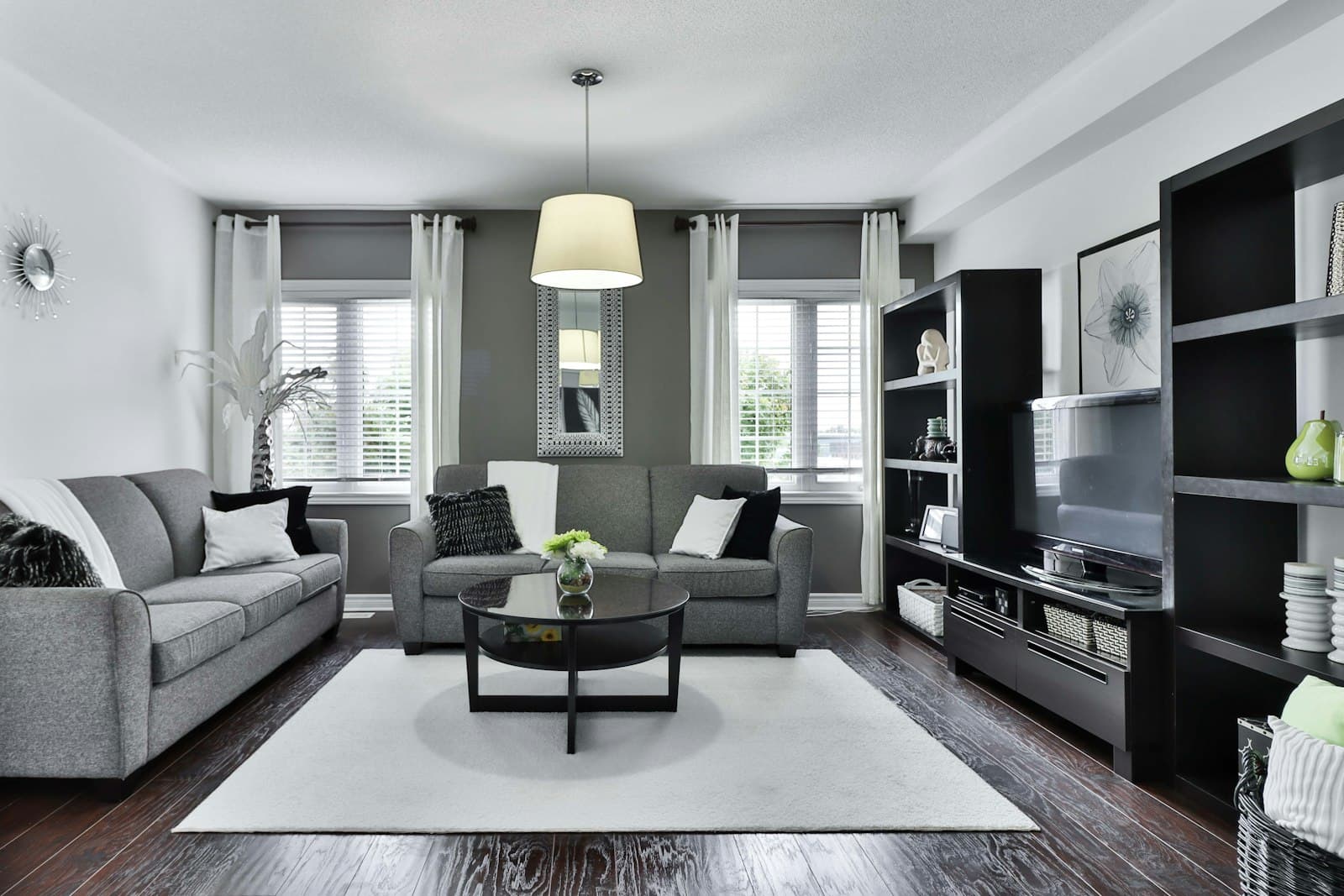 Living space opening onto a covered water-facing terrace.