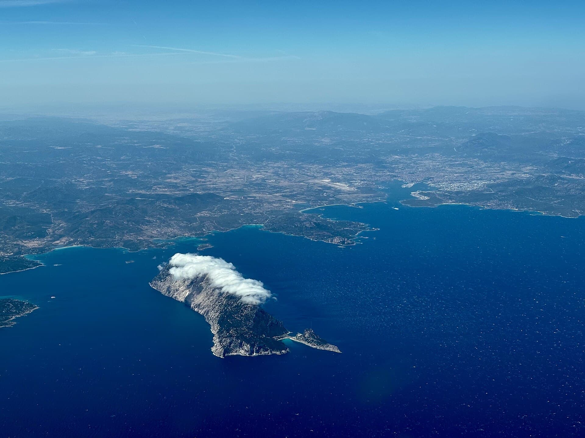 Aerial view of Tavolara rising from the sea off northeastern Sardinia.